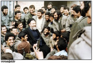 Ayatollah Beheshti talking between Iranian soldiers during Iran-Iraq war.
