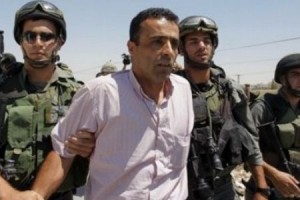 A Palestinian protester is detained during a demonstration against Israel.