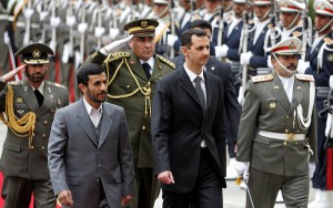 Presidents Mahmoud Ahmadinejad of Iran, left, and Bashar al-Assad of Syria, center, in Tehran in 2007.(Photo Credit: Atta Kenare/Agence France-Presse — Getty Images).