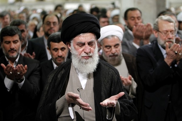 Iranian senior officials saying prayer.Supreme leader Khamenei standing in front while the President Ahmadinejad and the President elect Rowhani standing behind him. July 21,2013. (Photo Credit: Khamenei.ir)