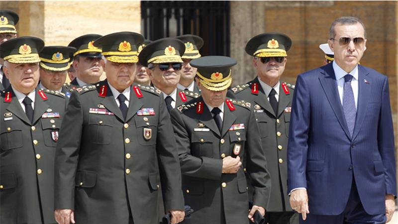PM Recep Tayyip Erdogan, right, chaired the Supreme Military Council which made the appointments [Reuters] 