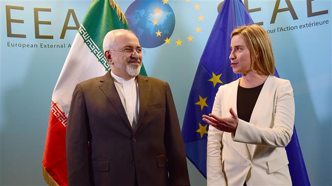 Iranian Foreign Minister Mohammad Javad Zarif (L) meets with EU foreign policy chief Federica Mogherini, at the EU headquarters in Brussels, Belgium, May 15, 2018.  